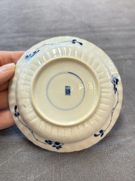 A set of six Chinese blue and white cups and saucers with floral design, Kangxi