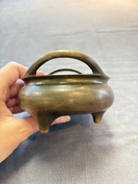 Two Chinese bronze tripod censers, Xuande marks, 19th C.