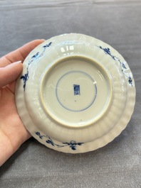 A set of six Chinese blue and white cups and saucers with floral design, Kangxi