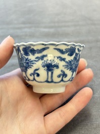 A set of six Chinese blue and white cups and saucers with floral design, Kangxi