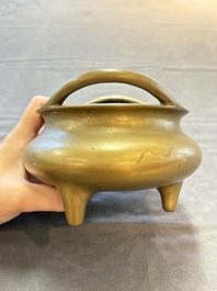 A Chinese bronze tripod censer, Xuande mark, 18th C.