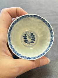 A set of six Chinese blue and white cups and saucers with floral design, Kangxi