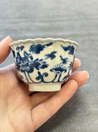 A set of six Chinese blue and white cups and saucers with floral design, Kangxi