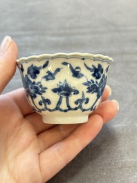 A set of six Chinese blue and white cups and saucers with floral design, Kangxi