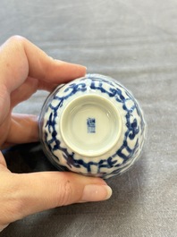 A set of six Chinese blue and white cups and saucers with floral design, Kangxi