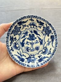 A set of six Chinese blue and white cups and saucers with floral design, Kangxi
