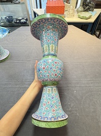 A pair of Chinese Canton enamel 'gu' vases with floral design, Qianlong