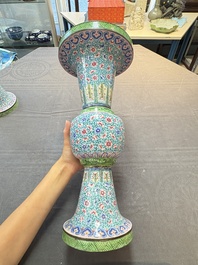 A pair of Chinese Canton enamel 'gu' vases with floral design, Qianlong