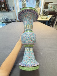 A pair of Chinese Canton enamel 'gu' vases with floral design, Qianlong