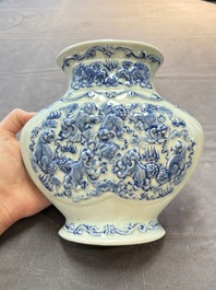A pair of Chinese blue and white celadon-ground 'Buddhist lions' wall pocket vases, Yongzheng mark, 19/20th C.