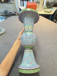 A pair of Chinese Canton enamel 'gu' vases with floral design, Qianlong