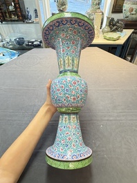 A pair of Chinese Canton enamel 'gu' vases with floral design, Qianlong