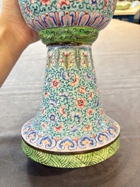 A pair of Chinese Canton enamel 'gu' vases with floral design, Qianlong