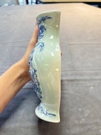 A pair of Chinese blue and white celadon-ground 'Buddhist lions' wall pocket vases, Yongzheng mark, 19/20th C.