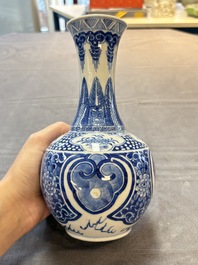 A Chinese blue and white vase with floral design, 19th C.