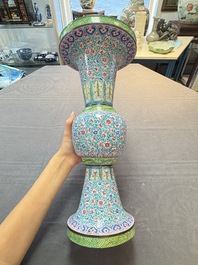 A pair of Chinese Canton enamel 'gu' vases with floral design, Qianlong