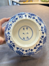 A Chinese blue and white molded bowl with elegant beauties and playing boys, Qi Yu Bao Ding Zhi Zhen 奇玉寶鼎之珍 mark, Kangxi