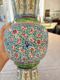 A pair of Chinese Canton enamel 'gu' vases with floral design, Qianlong