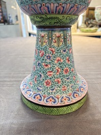 A pair of Chinese Canton enamel 'gu' vases with floral design, Qianlong