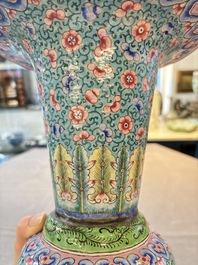 A pair of Chinese Canton enamel 'gu' vases with floral design, Qianlong