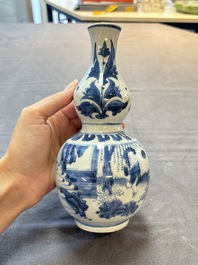 A Chinese blue and white 'playing boys' double gourd vase, Transitional period