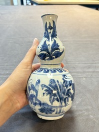 A Chinese blue and white 'playing boys' double gourd vase, Transitional period