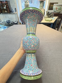 A pair of Chinese Canton enamel 'gu' vases with floral design, Qianlong