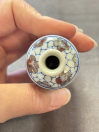 Three Chinese blue, white and copper-red snuff bottles, 19th C.