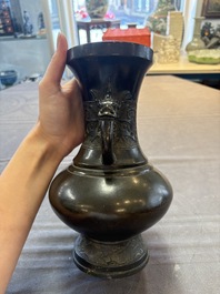 A Chinese archaistic bronze vase with 'mythical beast' handles, Yuan/Ming