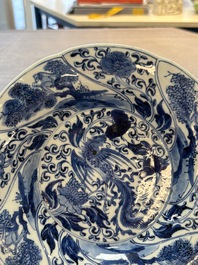 A Chinese blue and white lobed 'phoenix and monkey' plate, flower mark, Kangxi