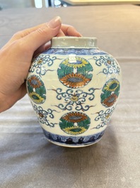 A pair of Chinese doucai 'chrysanthemum' jars and covers, Daoguang mark and of the period