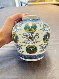 A pair of Chinese doucai 'chrysanthemum' jars and covers, Daoguang mark and of the period