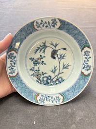 Four Chinese doucai plates with birds among bamboo and floral design, 18th C.