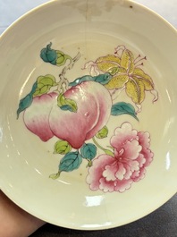 A Chinese famille rose ruby-back saucer dish with peaches and flowers, 18th C.