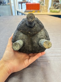 A Chinese archaic bronze tripod food vessel with 'taotie' design, 'ding 鼎', Western Zhou