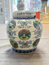 A pair of Chinese doucai 'chrysanthemum' jars and covers, Daoguang mark and of the period