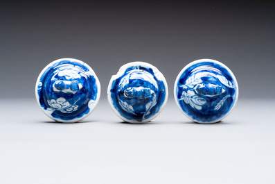 Three Chinese blue and white 'plum blossom' vases and covers, Kangxi mark, 19th C.