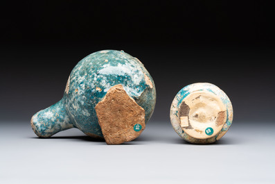 A small turquoise-glazed albarello and three oil lamps, Iran or Syria, 12/13th C.