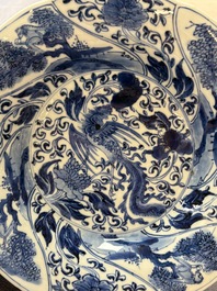 A Chinese blue and white lobed 'phoenix and monkey' plate, flower mark, Kangxi