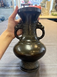A Chinese archaistic bronze vase with 'mythical beast' handles, Yuan/Ming