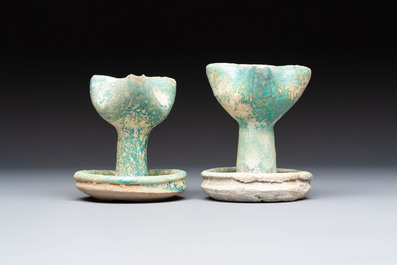 A small turquoise-glazed albarello and three oil lamps, Iran or Syria, 12/13th C.