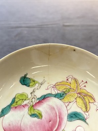 A Chinese famille rose ruby-back saucer dish with peaches and flowers, 18th C.