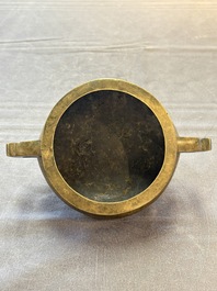 A Chinese bronze two-handled tripod censer, 19th C.