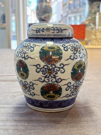 A pair of Chinese doucai 'chrysanthemum' jars and covers, Daoguang mark and of the period