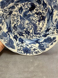 A Chinese blue and white lobed 'phoenix and monkey' plate, flower mark, Kangxi