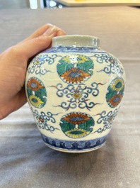 A pair of Chinese doucai 'chrysanthemum' jars and covers, Daoguang mark and of the period