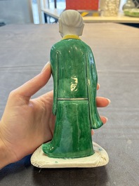 A Chinese verte biscuit Luohan holding a ruyi, Kangxi