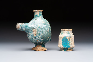 A small turquoise-glazed albarello and three oil lamps, Iran or Syria, 12/13th C.