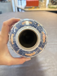 Three Chinese famille rose 'mandarin subject' vases and covers, Qianlong