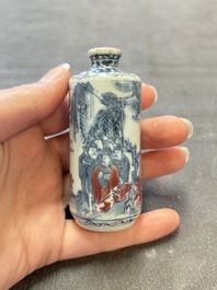 Three Chinese blue, white and copper-red snuff bottles, 19th C.